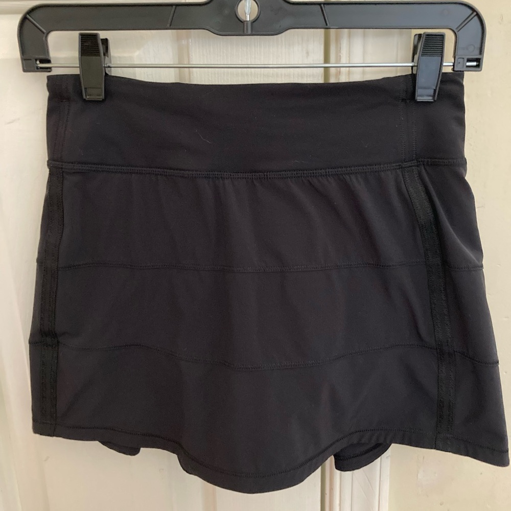Lululemon black tennis mini skirt with shorts underneath.